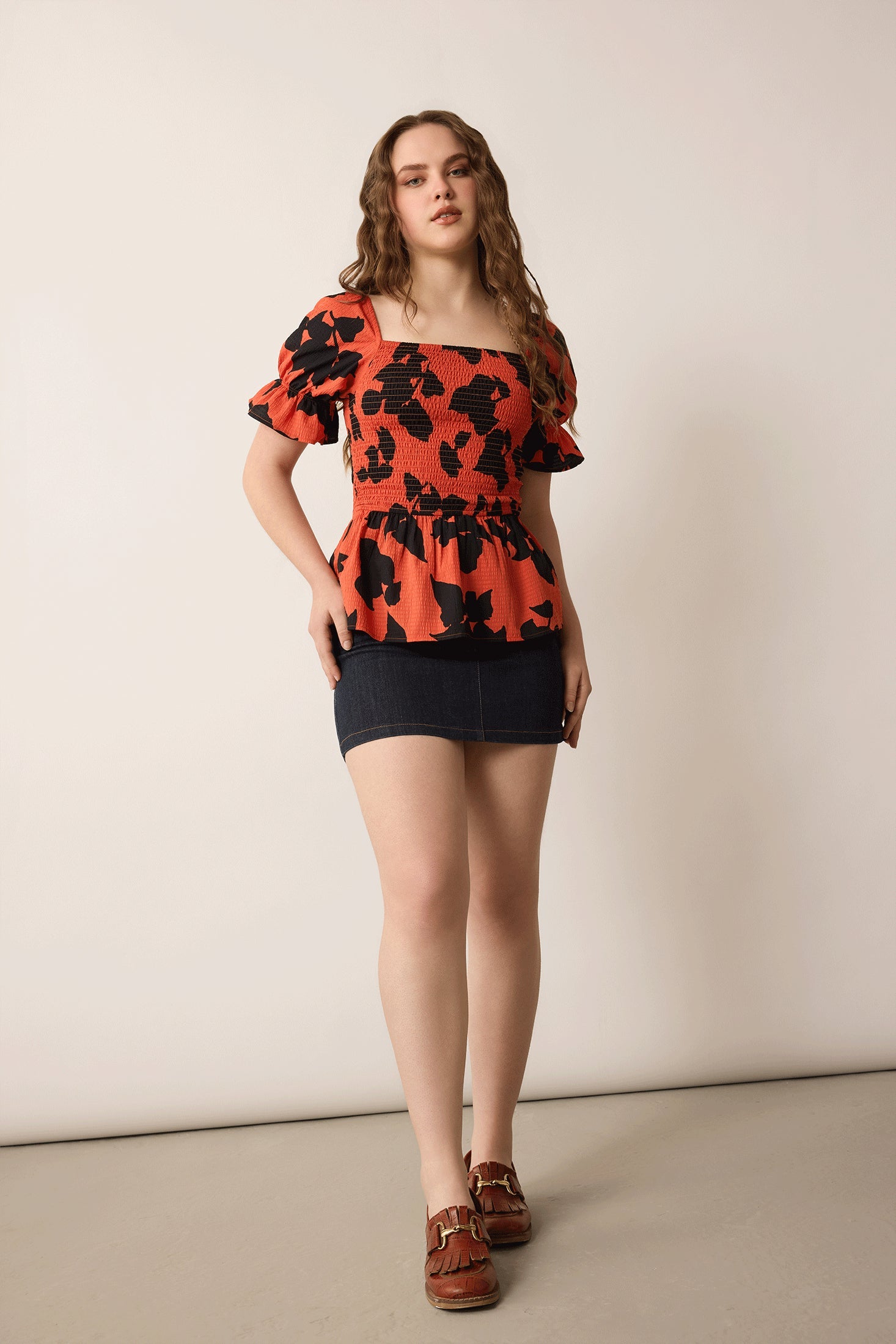 Bailey in Bold Peplum Top In Orange and Black